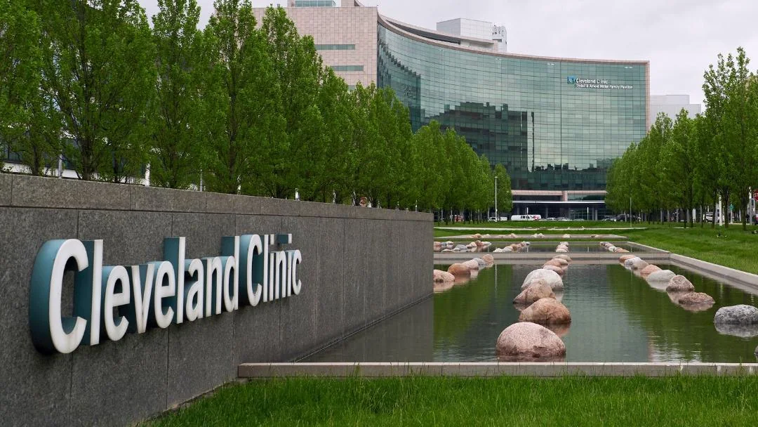 The Cleveland Clinic main campus in Cleveland, Ohio, with its sign in the foreground.
